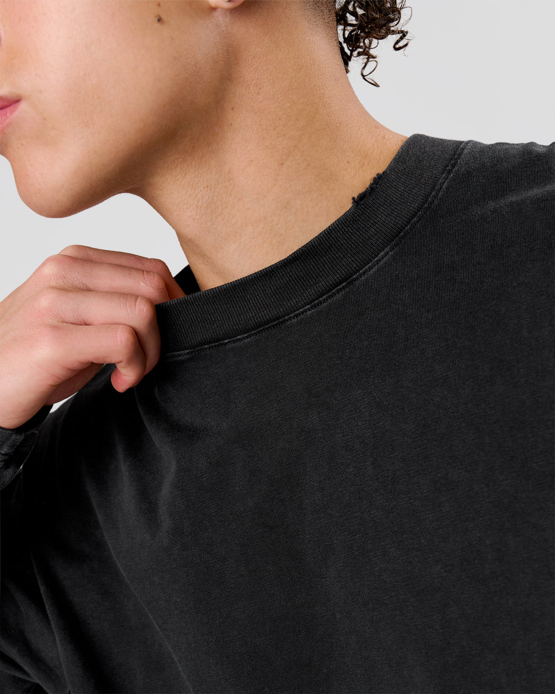 Man wearing Backline Washed Heavyweight Oversized LS Tee - Black Washed | Model:Leandro | Size:M - view 5