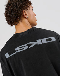 Man wearing Backline Washed Heavyweight Oversized LS Tee - Black Washed | Model:Leandro | Size:M | Thumbnail Index: 6