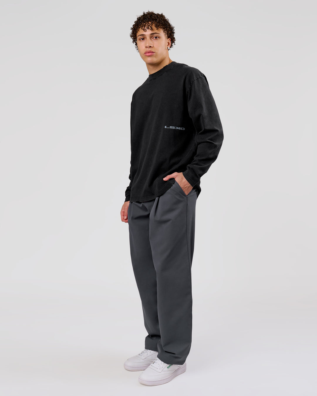 Man wearing Backline Washed Heavyweight Oversized LS Tee - Black Washed | Model:Leandro | Size:M - view 11