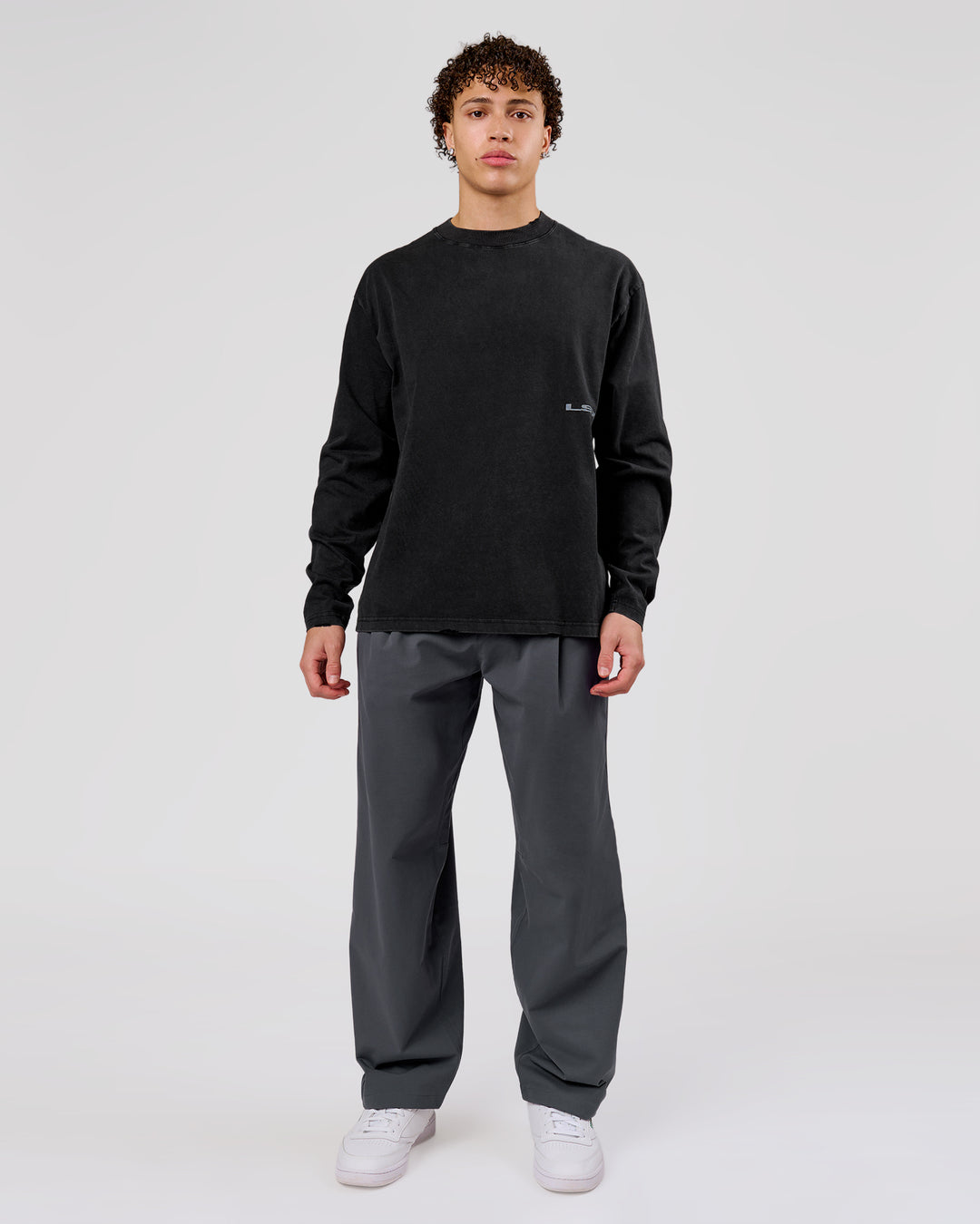 Man wearing Backline Washed Heavyweight Oversized LS Tee - Black Washed | Model:Leandro | Size:M - view 15