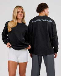 Man wearing Backline Washed Heavyweight Oversized LS Tee - Black Washed | Model:Leandro | Size:M | Thumbnail Index: 16