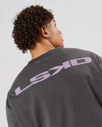 Man wearing Backline Washed Heavyweight Oversized Tee - Asphalt Washed | Model:Leandro | Size:M | Thumbnail Index: 12