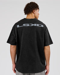 Man wearing Backline Washed Heavyweight Oversized Tee - Black Washed | Model:Leandro | Size:M | Thumbnail Index: 0