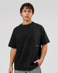 Man wearing Backline Washed Heavyweight Oversized Tee - Black Washed | Model:Leandro | Size:M | Thumbnail Index: 2
