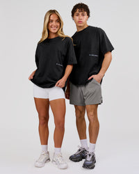 Man wearing Backline Washed Heavyweight Oversized Tee - Black Washed | Model:Leandro | Size:M | Thumbnail Index: 15