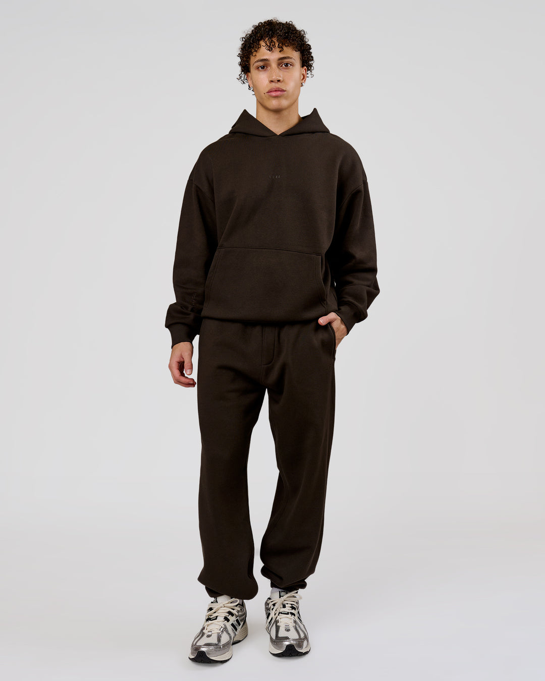 Man wearing Base Baggy Cuffed Track Pant - Ground Coffee | Model:Leandro | Size:M - view 2