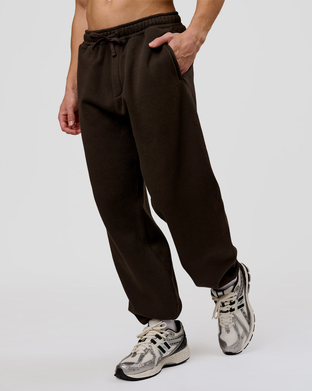 Man wearing Base Baggy Cuffed Track Pant - Ground Coffee | Model:Leandro | Size:M - view 9