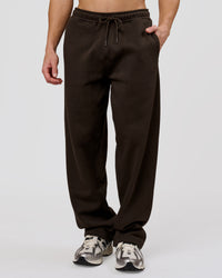 Man wearing Base Wide Leg Track Pant - Ground Coffee | Model:Leandro | Size:M | Thumbnail Index: 0