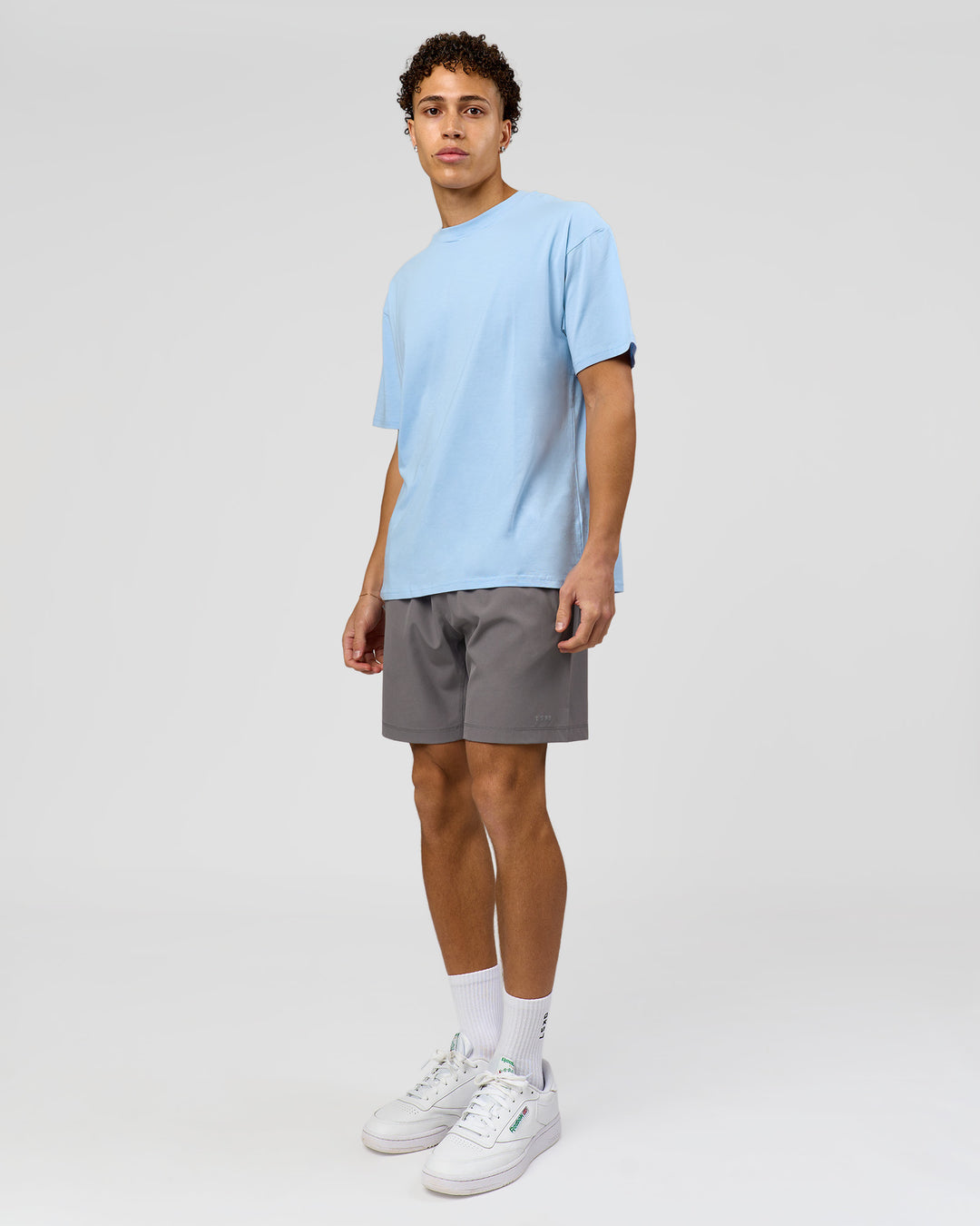 Man wearing Benchmark FLXCotton Oversized Tee - Open Air-Blue Bell | Model:Leandro | Size:M - view 9