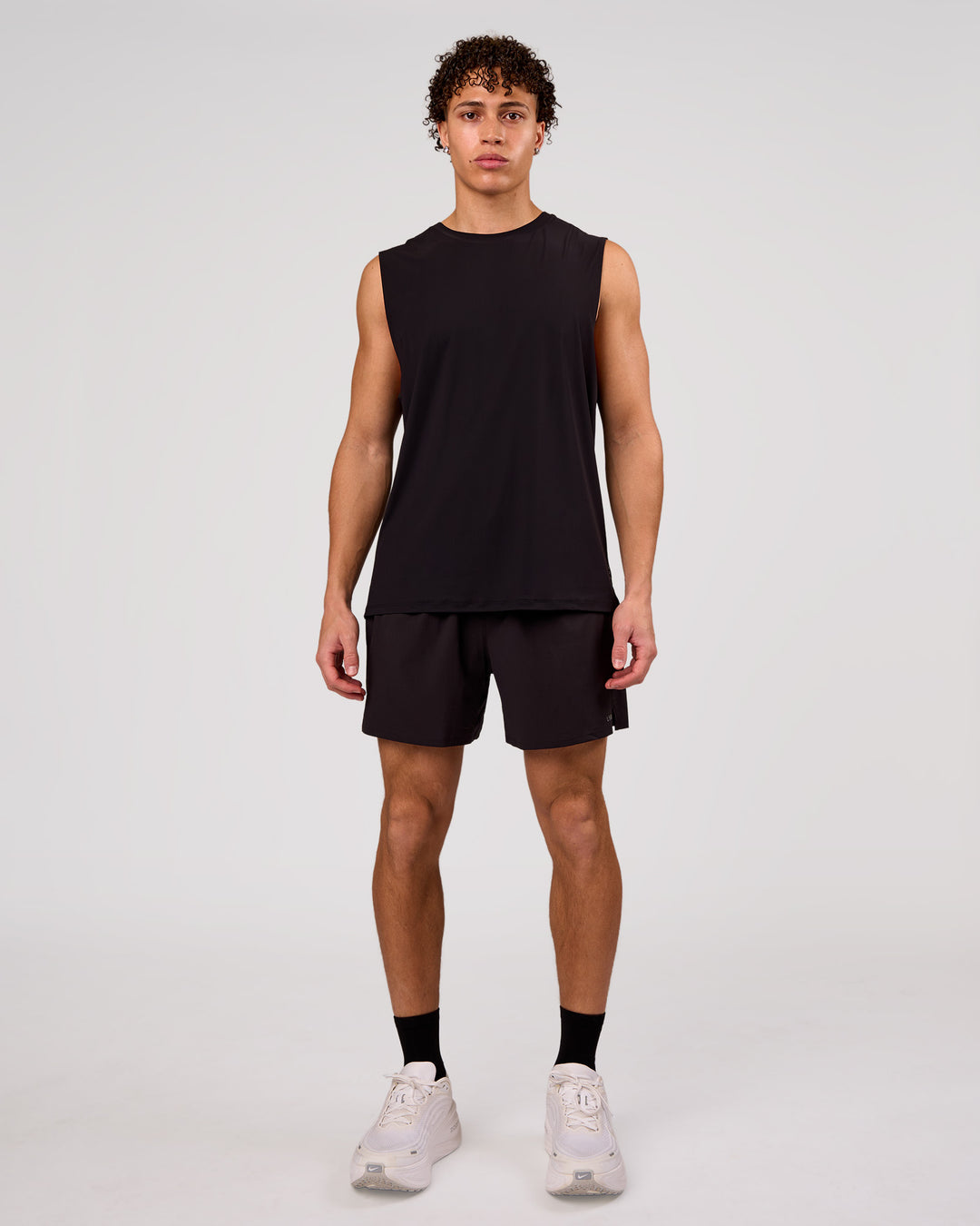 Man wearing Cadence MicroMotion Muscle Tank - Black | Model:Leandro | Size:M - view 3