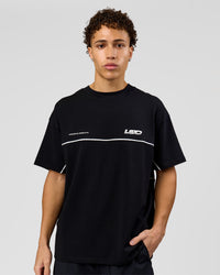 Man wearing Inline Heavyweight FLXCotton Oversized Tee - Black-White | Model:Leandro | Size:M | Thumbnail Index: 4