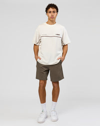 Man wearing Inline Heavyweight FLXCotton Oversized Tee - Off White-Hot Chocolate | Model:Leandro | Size:M | Thumbnail Index: 5