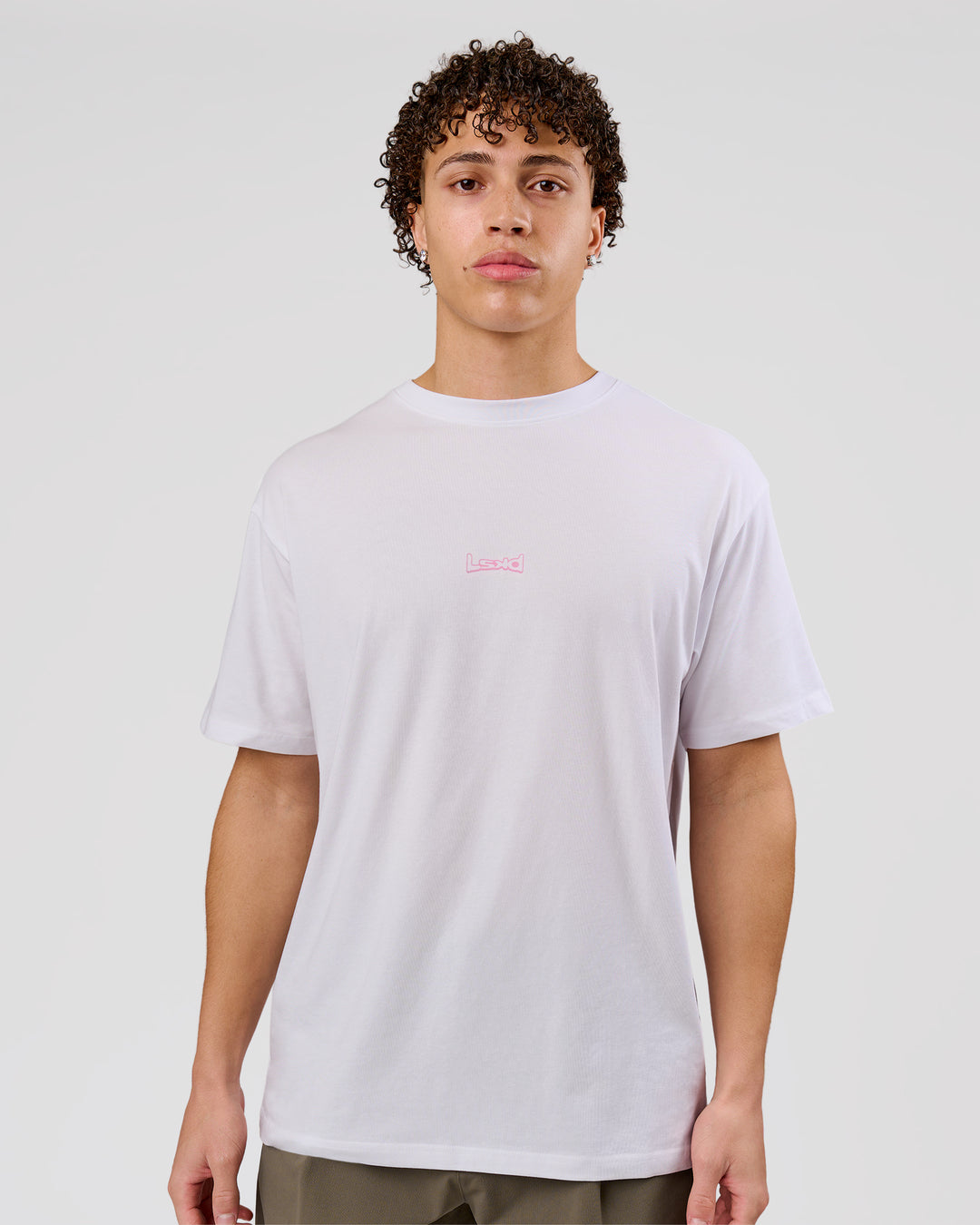 Man wearing Magma FLXCotton Oversize Tee  - White-Pink Rose | Model:Leandro | Size:M - view 14