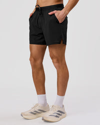 Man wearing Movember x LSKD Pace 5" Lined Running Short - Black | Model:Leandro | Size:M | Thumbnail Index: 12