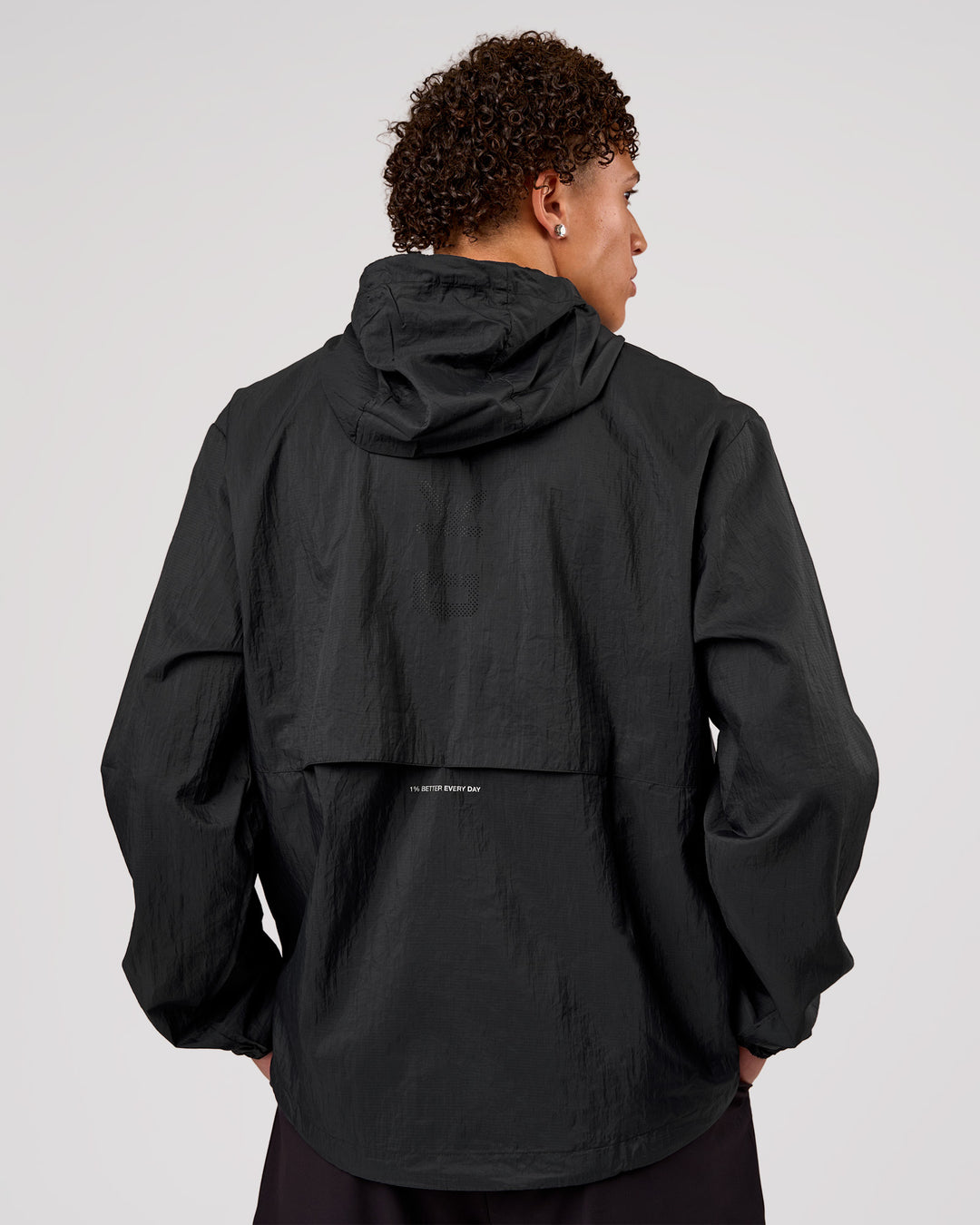 Man wearing Pace+ Lightweight Running Jacket - Black | Model:Leandro | Size:M - view 2