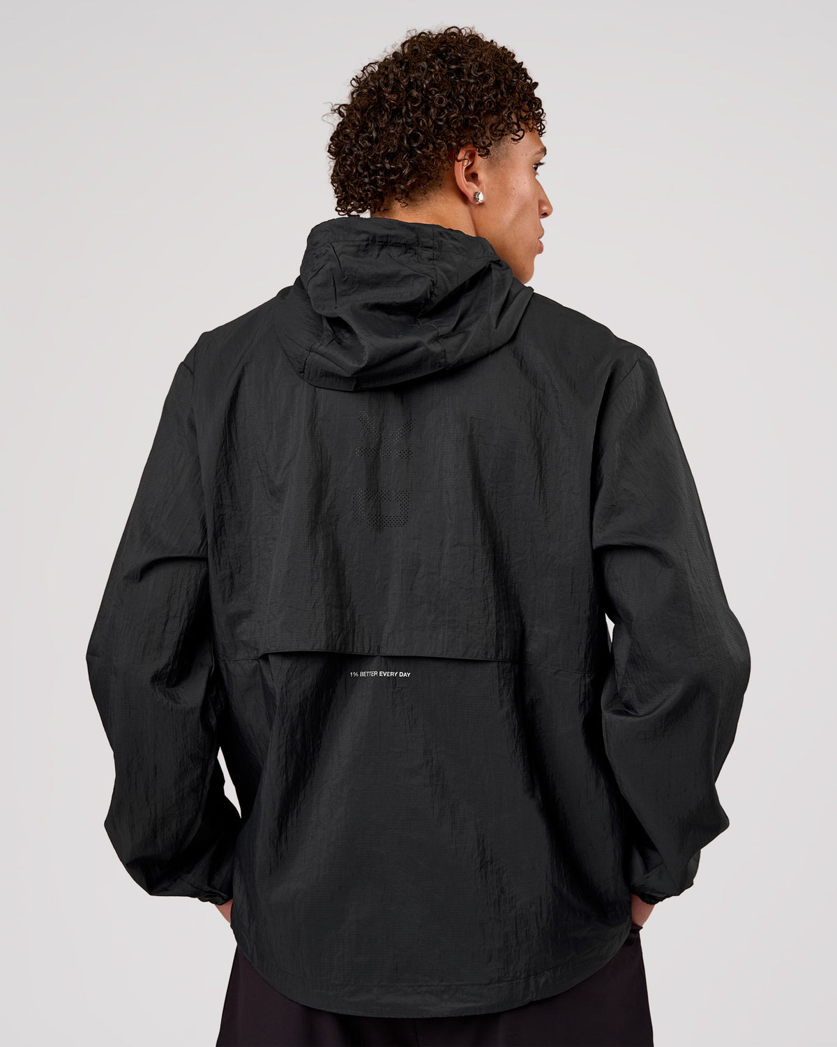 Man wearing Pace+ Lightweight Running Jacket - Black | Model:Leandro | Size:M - view 2