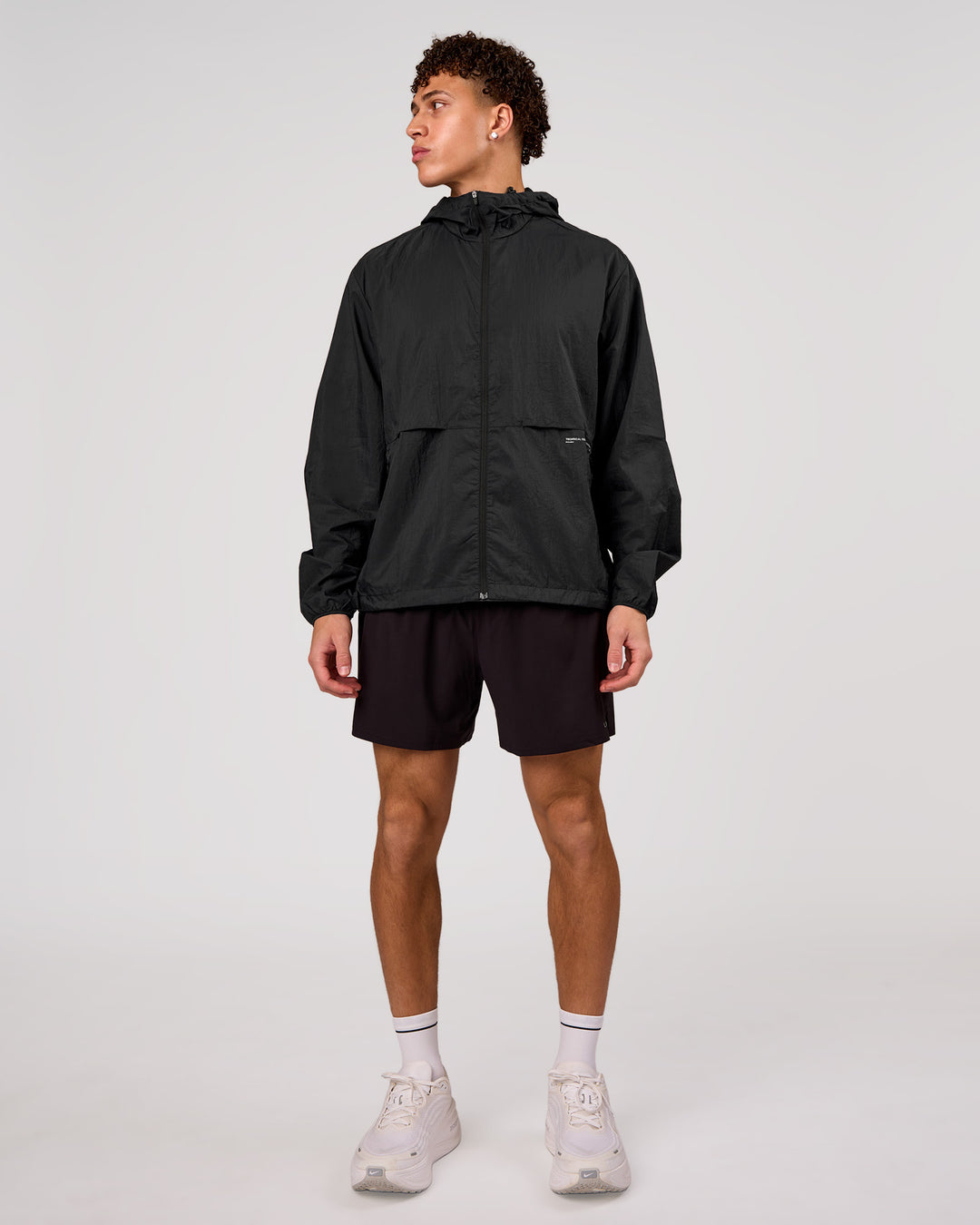 Man wearing Pace+ Lightweight Running Jacket - Black | Model:Leandro | Size:M - view 3