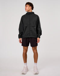 Man wearing Pace+ Lightweight Running Jacket - Black | Model:Leandro | Size:M | Thumbnail Index: 2