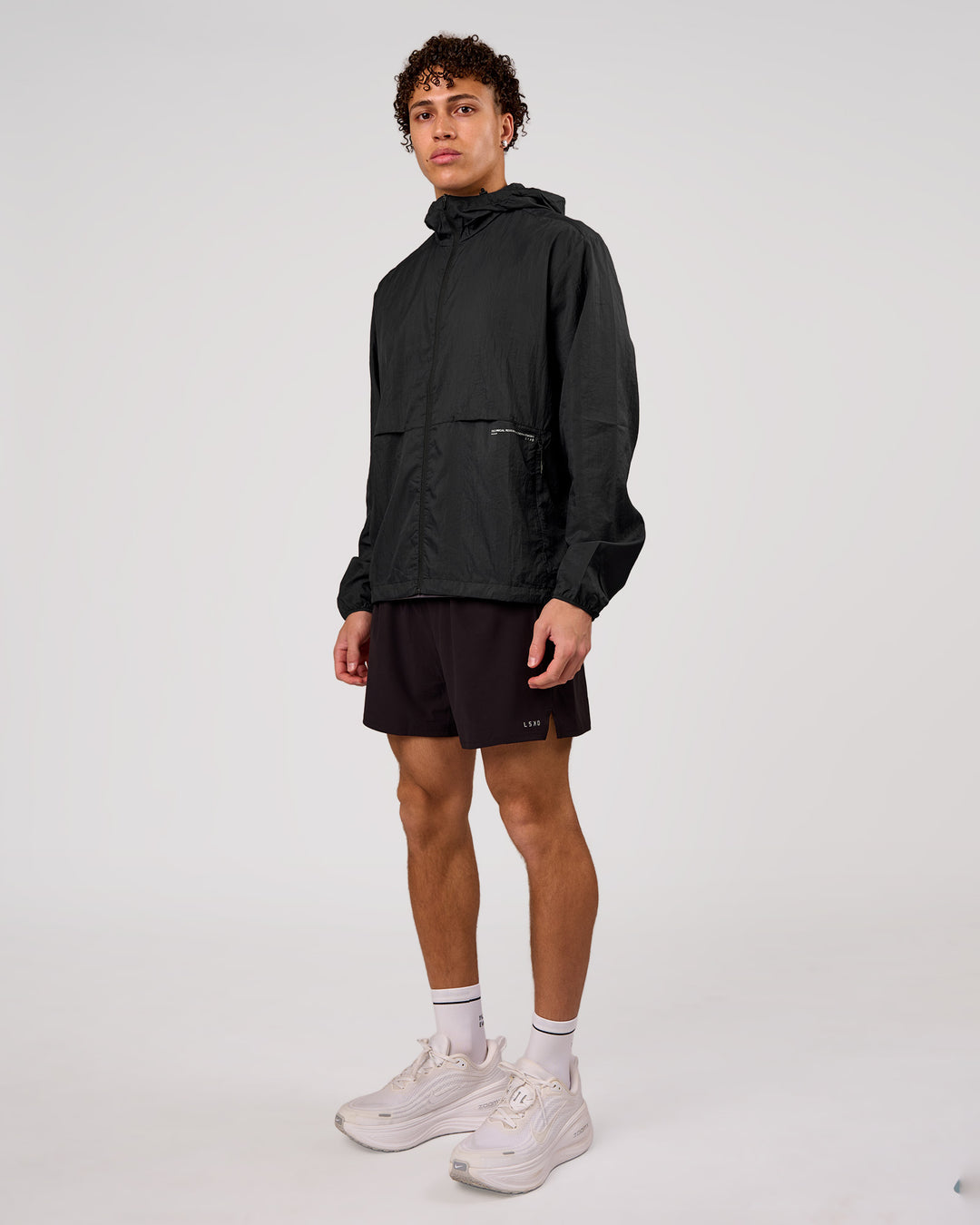 Man wearing Pace+ Lightweight Running Jacket - Black | Model:Leandro | Size:M - view 7