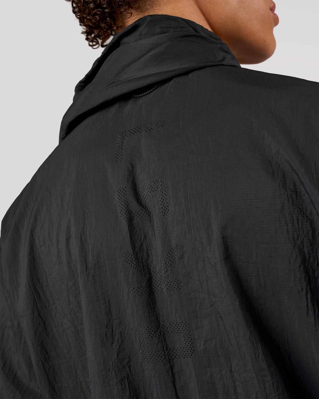Man wearing Pace+ Lightweight Running Jacket - Black | Model:Leandro | Size:M - view 8