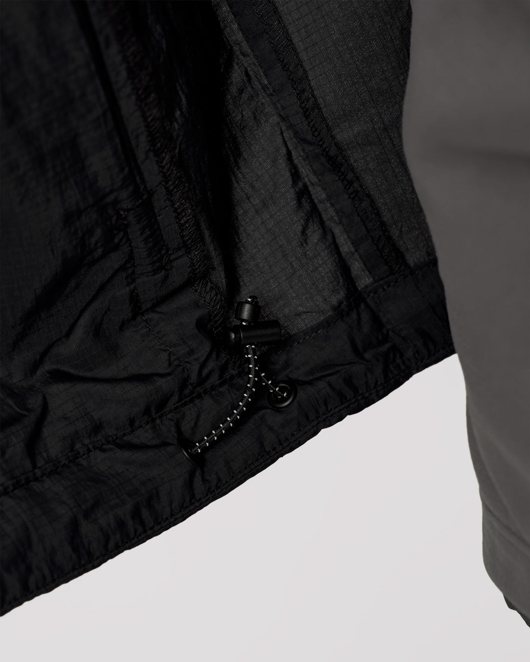 Man wearing Pace+ Lightweight Running Jacket - Black | Model:Leandro | Size:M - view 11