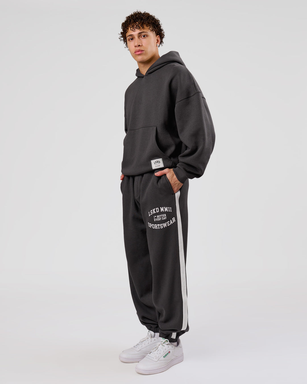 Man wearing Playbook Baggy Cuffed Track Pant - Onyx-Off White | Model:Leandro | Size:M - view 5