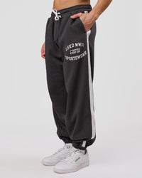 Man wearing Playbook Baggy Cuffed Track Pant - Onyx-Off White | Model:Leandro | Size:M | Thumbnail Index: 2