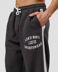 Man wearing Playbook Baggy Cuffed Track Pant - Onyx-Off White | Model:Leandro | Size:M | Thumbnail Index: 12