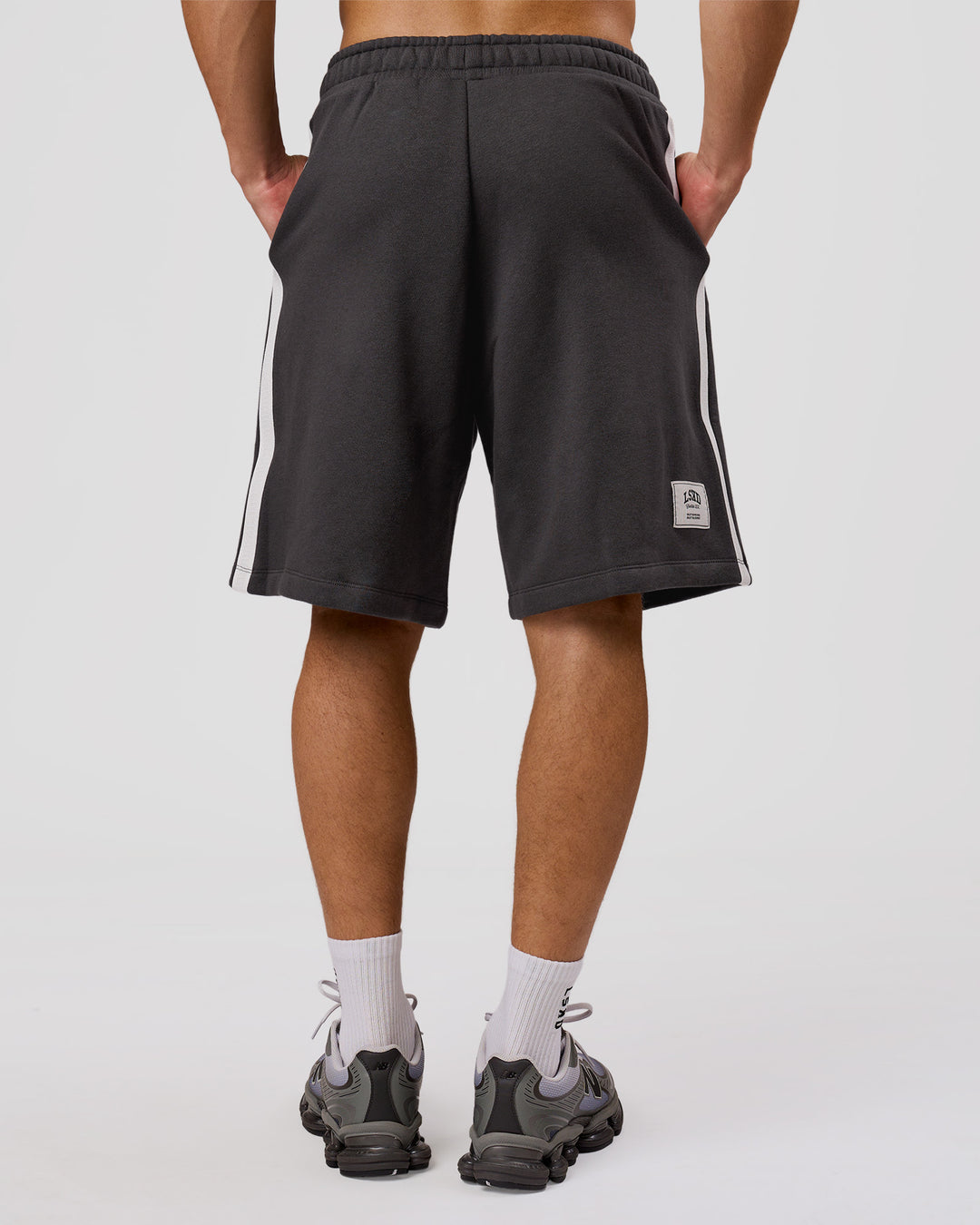 Man wearing Playbook Varsity Fleece Shorts - Onyx-Off White | Model:Leandro | Size:M - view 4