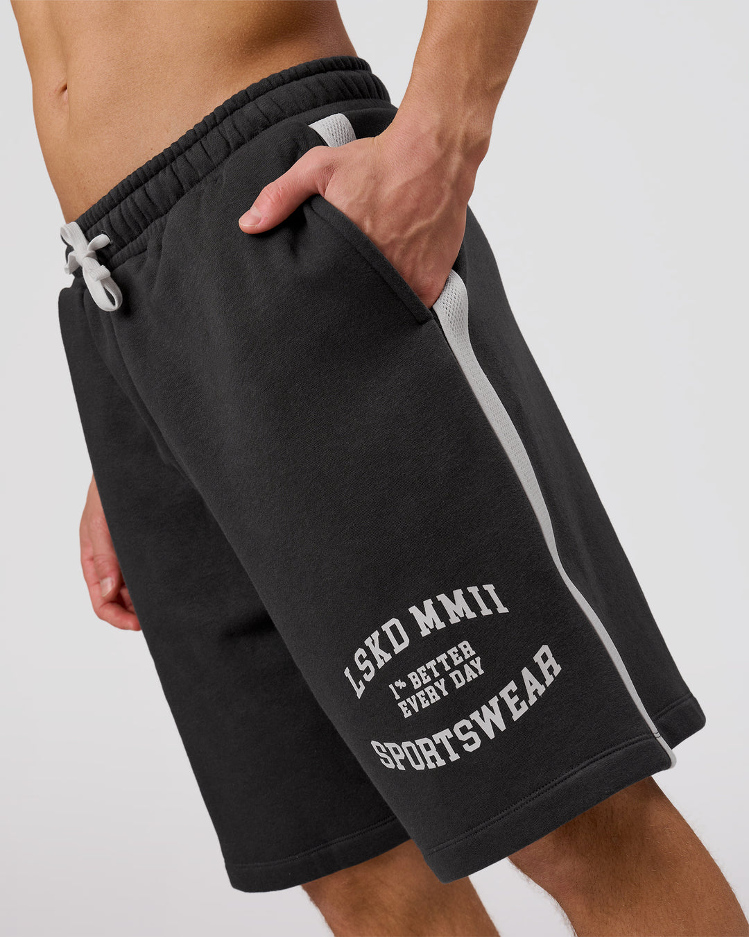 Man wearing Playbook Varsity Fleece Shorts - Onyx-Off White | Model:Leandro | Size:M - view 9