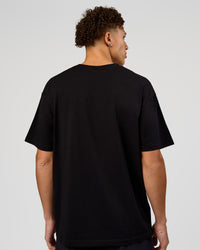Man wearing VS1 Enjoy The Journey FLXCotton Oversize Tee - Black | Model:Leandro | Size:M | Thumbnail Index: 8
