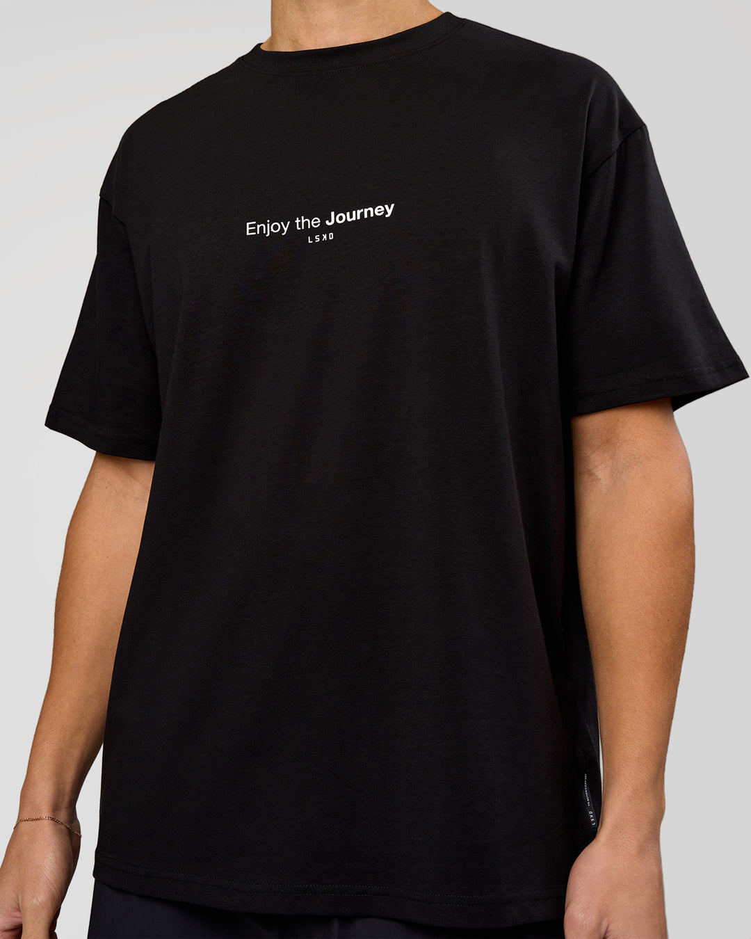 Man wearing VS1 Enjoy The Journey FLXCotton Oversize Tee - Black | Model:Leandro | Size:M - view 11