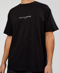 Man wearing VS1 Enjoy The Journey FLXCotton Oversize Tee - Black | Model:Leandro | Size:M | Thumbnail Index: 10