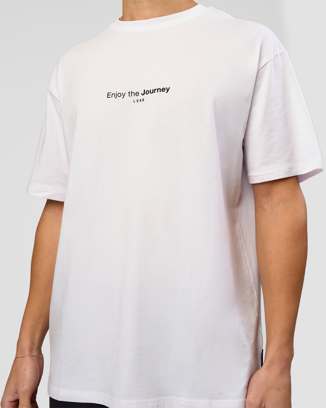 Man wearing VS1 Enjoy The Journey FLXCotton Oversize Tee - White | Model:Leandro | Size:M - view 4