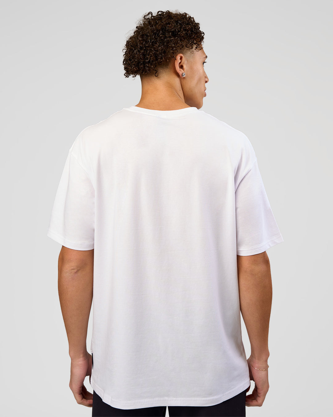 Man wearing VS1 Enjoy The Journey FLXCotton Oversize Tee - White | Model:Leandro | Size:M - view 6