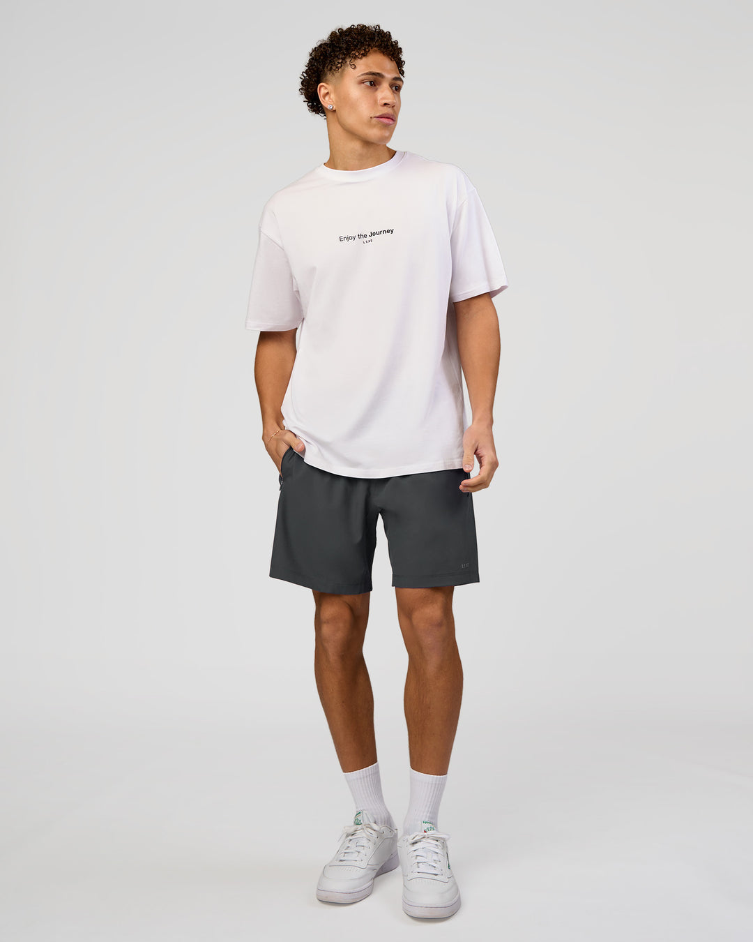 Man wearing VS1 Enjoy The Journey FLXCotton Oversize Tee - White | Model:Leandro | Size:M - view 9