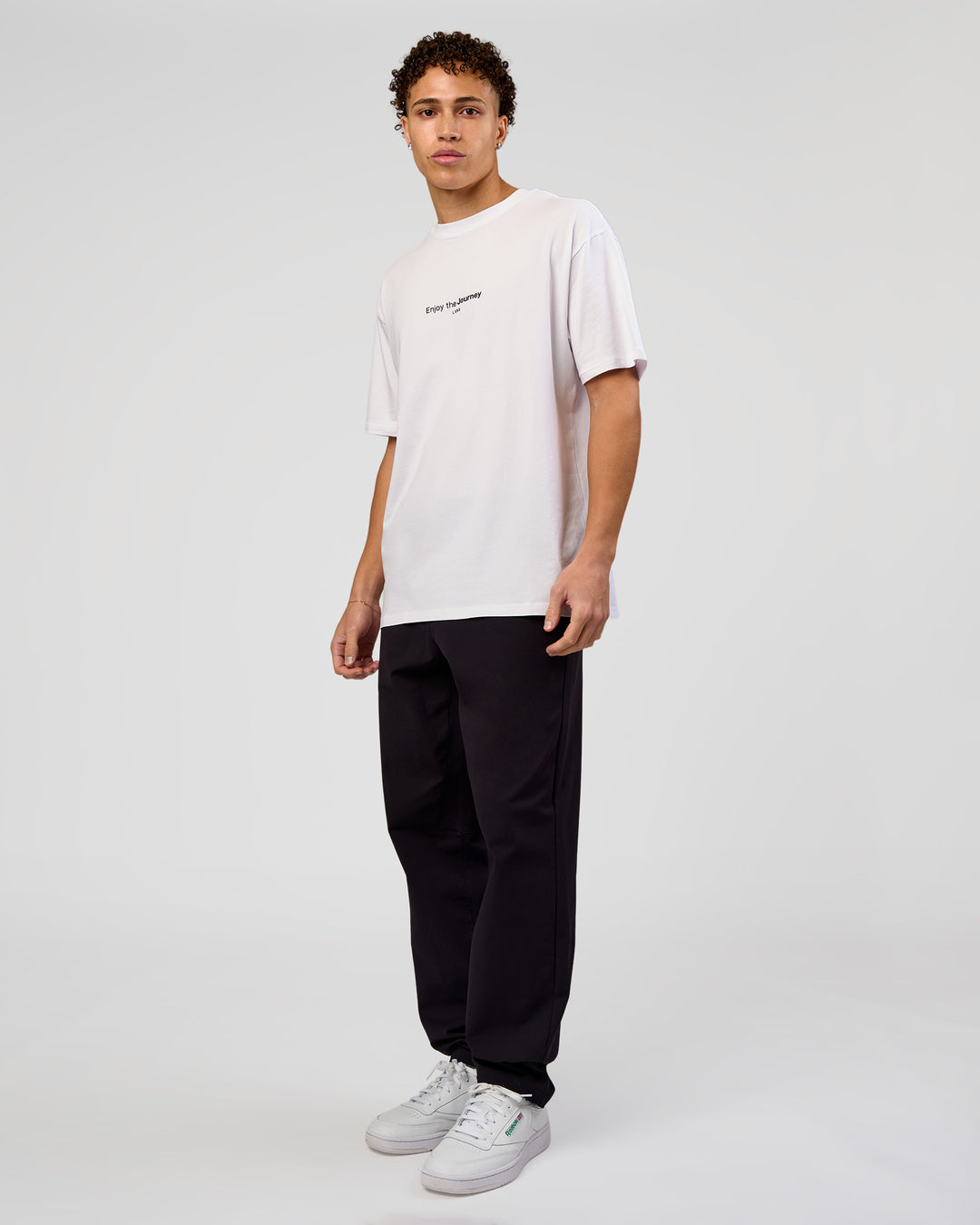 Man wearing VS1 Enjoy The Journey FLXCotton Oversize Tee - White | Model:Leandro | Size:M - view 11
