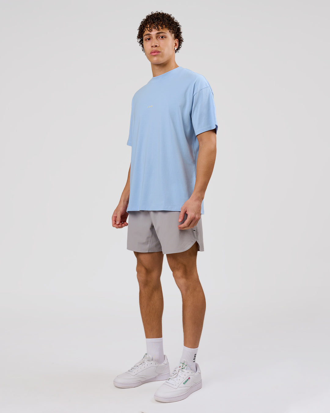 Man wearing VS26 Journey FLXCotton Oversize Tee - Open Air-Lemon | Model:Leandro | Size:M - view 11
