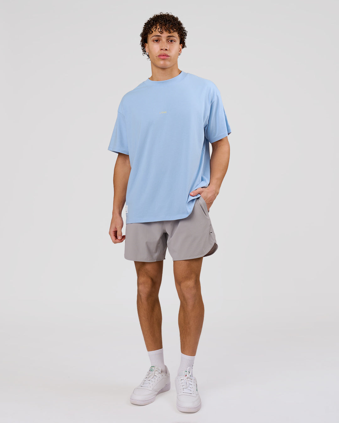 Man wearing VS26 Journey FLXCotton Oversize Tee - Open Air-Lemon | Model:Leandro | Size:M - view 13