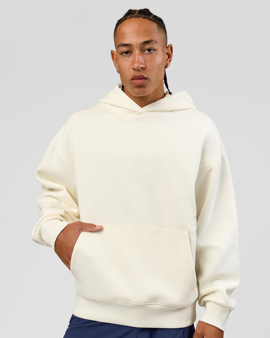 Man wearing Greatest of All Time Heavyweight Oversized Hoodie - Off White | Model:Malebo | Size:M - view 9