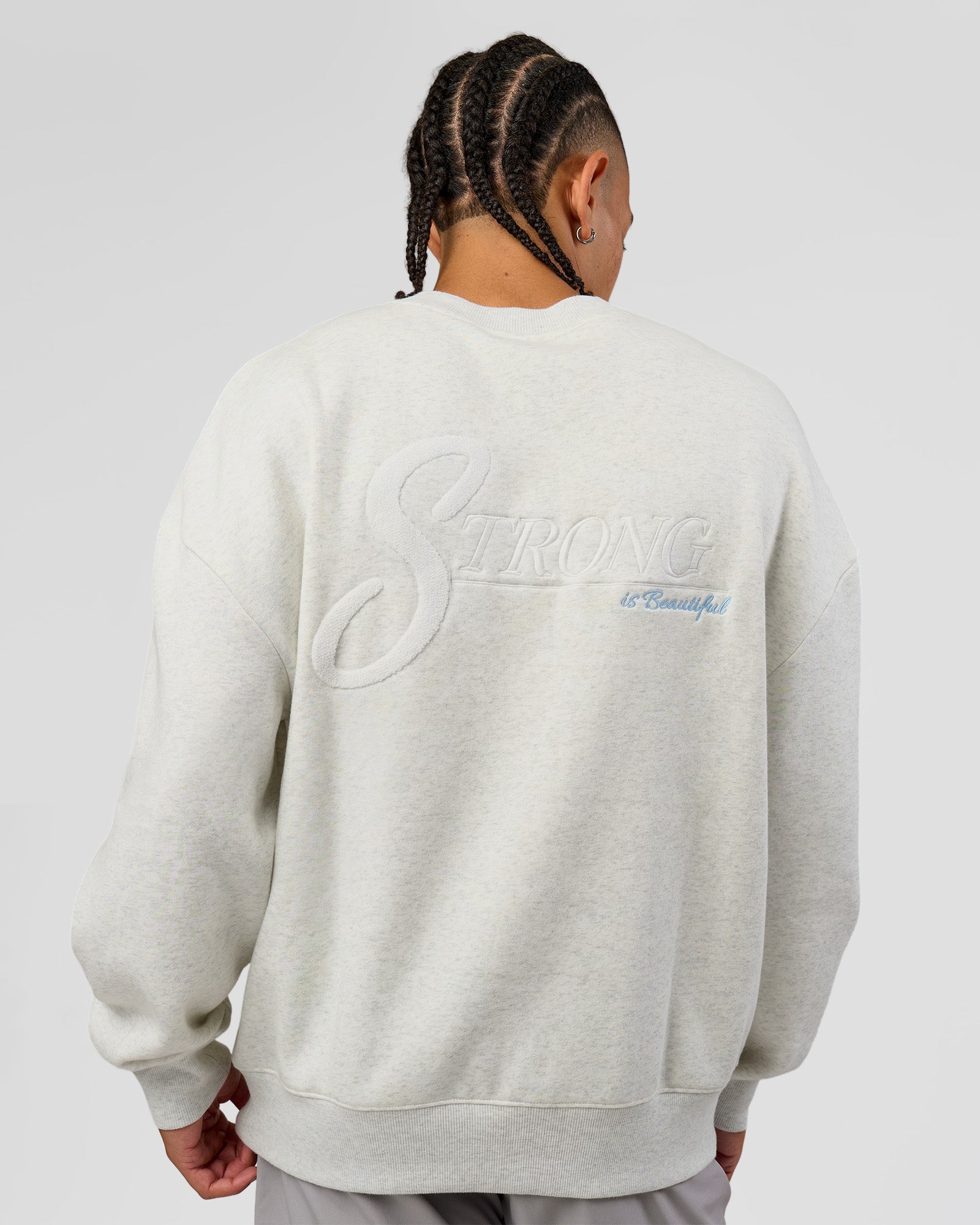 Man wearing Strong is Beautiful Oversized Sweater - Silver Marl | Model:Malebo | Size:M