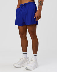 Man wearing UltraAir 5" Lined Performance Short  - Electric Indigo | Model:Malebo | Size:M | Thumbnail Index: 2