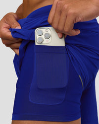 Man wearing UltraAir 5" Lined Performance Short  - Electric Indigo | Model:Malebo | Size:M | Thumbnail Index: 1