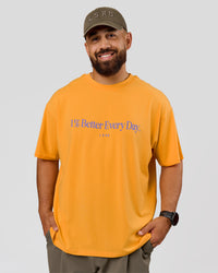 Man wearing VS6 1% Better Fathers Day FLXCotton Oversized Tee - Warm Apricot | Model:Jordan | Size:XL | Thumbnail Index: 1