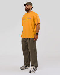 Man wearing VS6 1% Better Fathers Day FLXCotton Oversized Tee - Warm Apricot | Model:Jordan | Size:XL | Thumbnail Index: 12