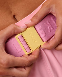 Studio image of Accelerate Run Belt - Lemon-Pink Rose | Thumbnail Index: 4