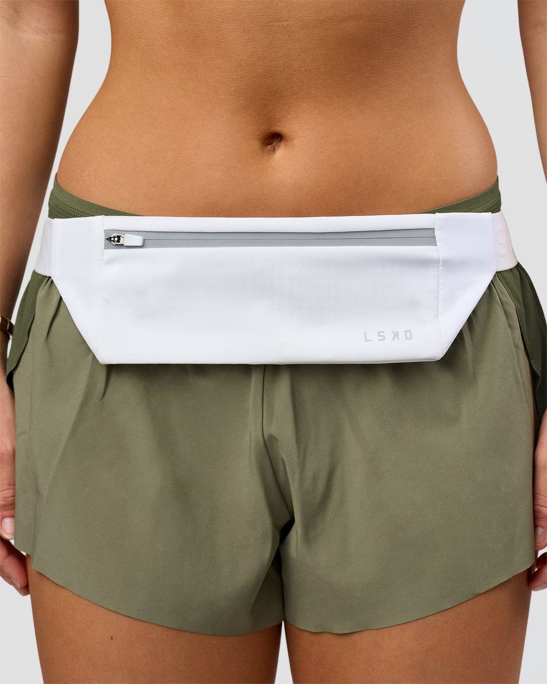 Studio image of Accelerate Run Belt - White-Reflective - view 3