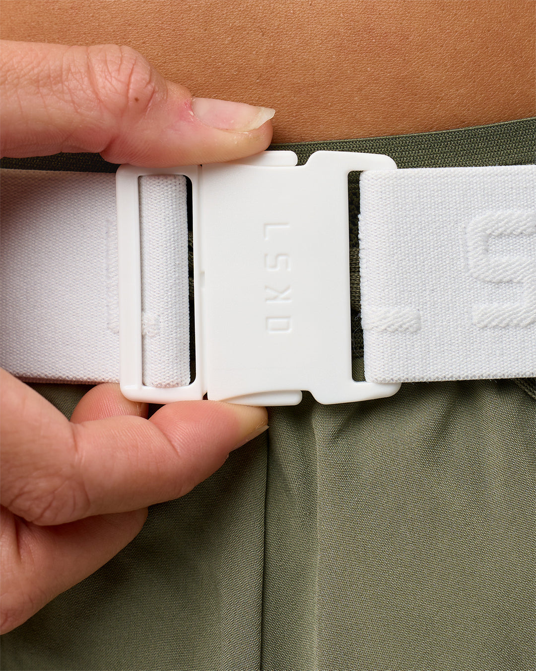 Studio image of Accelerate Run Belt - White-Reflective - view 10