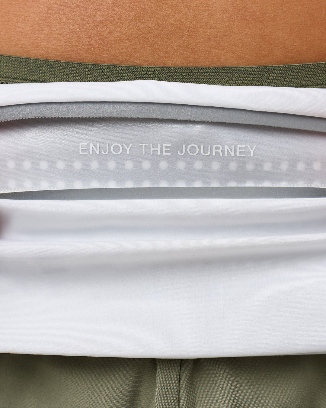 Studio image of Accelerate Run Belt - White-Reflective - view 12