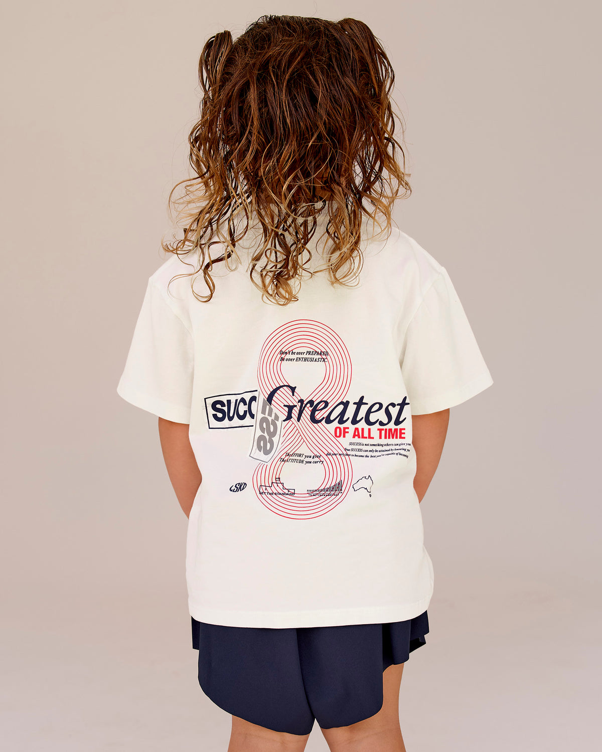 Studio image of Kids Greatest of All Time FLXCotton Tee - Off White Washed-Scarlet